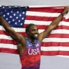 American sprinter Noah Lyles celebrates after winning the gold medal in in the men's 100-meters final at the Paris Olympics on Sunday in Saint-Denis.