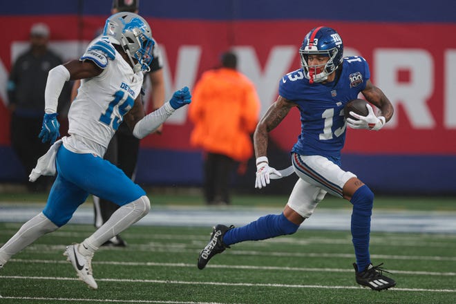 New York Giants wide receiver Jalin Hyatt gains yards after the catch as Detroit Lions cornerback Ennis Rakestraw Jr. pursues at MetLife Stadium, Aug. 8, 2024 in East Rutherford, N.J.