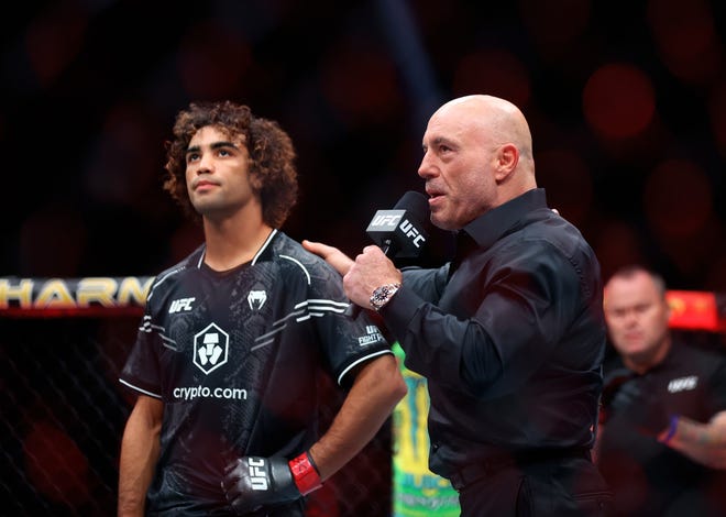 Jun 29, 2024; Las Vegas, Nevada, USA; Payton Talbott (left) is interviewed by Joe Rogan during UFC 303 at T-Mobile Arena. Mandatory Credit: Mark J. Rebilas-USA TODAY Sports