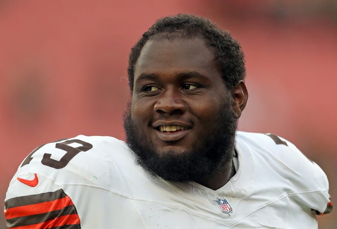 Cleveland Browns offensive tackle Dawand Jones (79) is all smiles after an NFL preseason football game at Cleveland Browns Stadium, Saturday, Aug. 10, 2024, in Cleveland, Ohio.