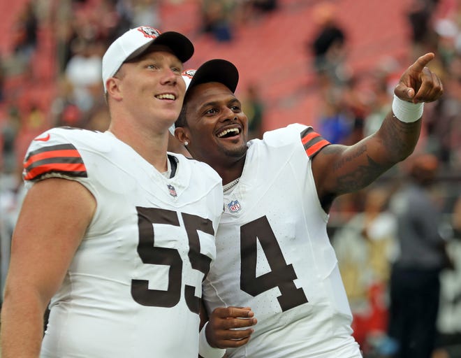 Cleveland Browns center Ethan Pocic (55) and quarterback Deshaun Watson (4) look at the crowd during the second half of an NFL preseason football game at Cleveland Browns Stadium, Saturday, Aug. 10, 2024, in Cleveland, Ohio.