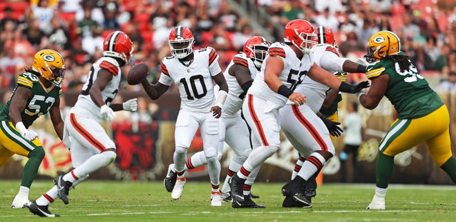 Cleveland Browns quarterback Tyler Huntley, center, looks to throw during the first half of an NFL preseason football game against the Green Bay Packers at Cleveland Browns Stadium, Saturday, Aug. 10, 2024, in Cleveland, Ohio.