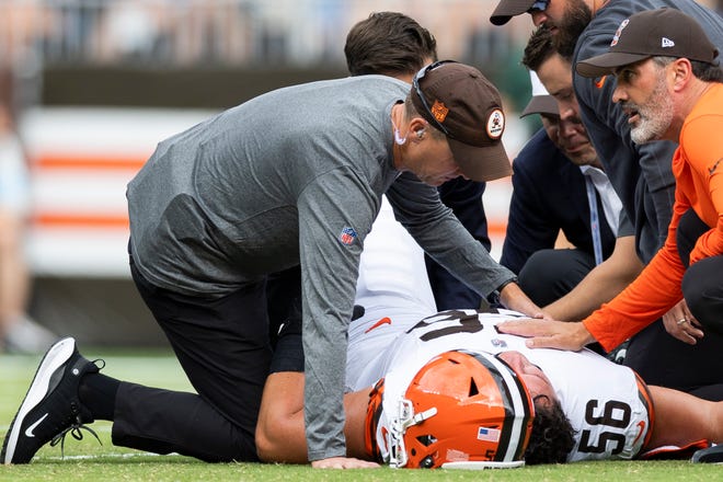 Aug 10, 2024; Cleveland, Ohio, USA; Cleveland Browns head coach Kevin Stefanski Kevin Stefanski and medical personnel attend to injured center Luke Wypler (56) during the second quarter against the Green Bay Packers at Cleveland Browns Stadium. Mandatory Credit: Scott Galvin-USA TODAY Sports