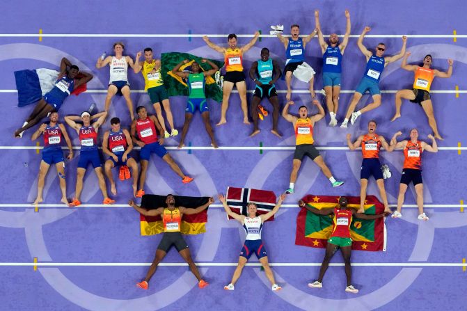 Decathletes lie on the track for a photo at the end of the last event on August 3. At bottom are silver medalist Leo Neugebauer of Germany, <a href=