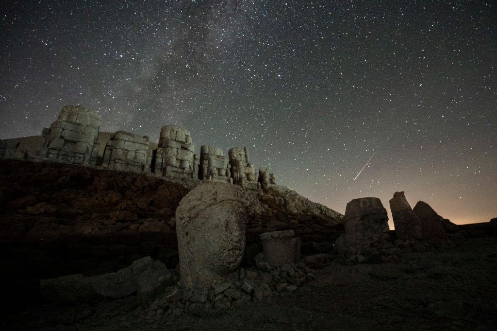 this photo shows the massive stone head sculptures at the archaeological site of Mount Nemrut in Adyaman, southeastern Turkey