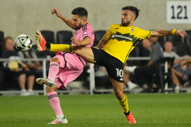 Columbus Crew forward Diego Rossi (10) fights for the ball with Inter Miami defender Jordi Alba.