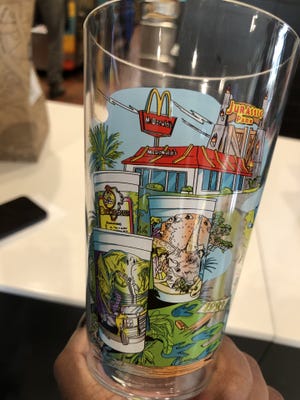 A McDonald's Collector's Meal cup includes "Jurassic Park" images.