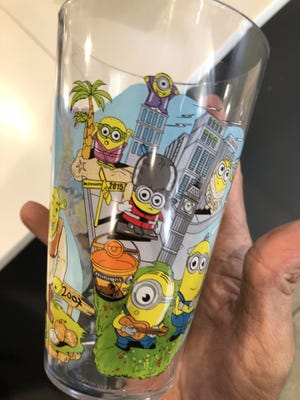 A McDonald's Collector's Meal cup includes images of Minions characters.