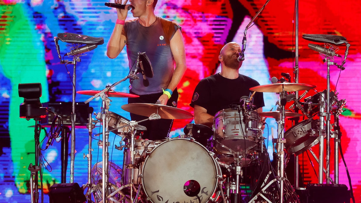 Chris Martin and Will Champion of the band Coldplay perform during the Rock in Rio Festival