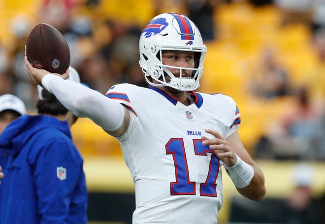 Buffalo Bills quarterback Josh Allen (17) warms up on the field before a game against the Pittsburgh Steelers at Acrisure Stadium.