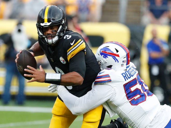 Buffalo Bills defensive end Greg Rousseau (50) sacks Pittsburgh Steelers quarterback Russell Wilson (3) during the first quarter at Acrisure Stadium. Rousseau had two sacks in the game.