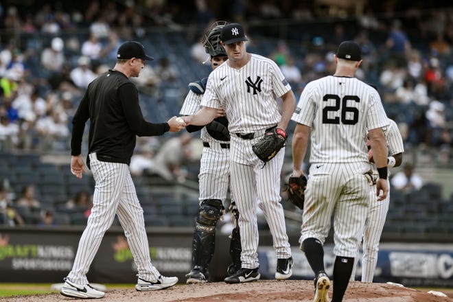 Aug 10, 2024; Bronx, New York, USA; New York Yankees pitcher Gerrit Cole (45) exits the game against the Texas Rangers during the sixth inning at Yankee Stadium. Mandatory Credit: John Jones-USA TODAY Sports