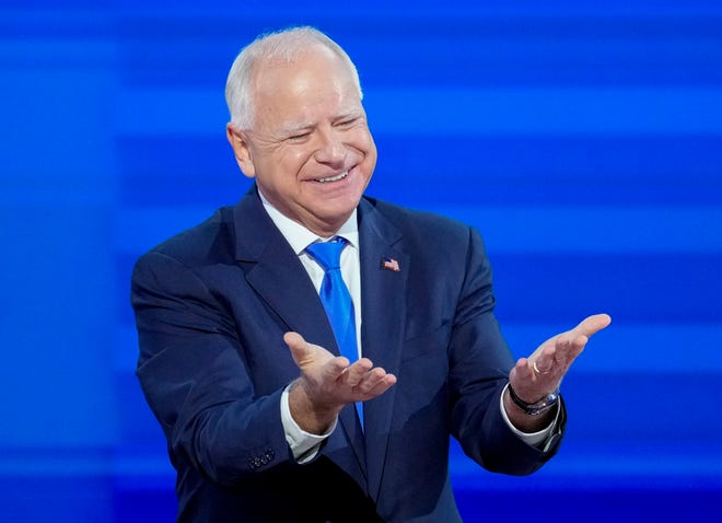 Democratic Vice Presidential nominee Tim Walz takes the stage to give an acceptance speech during the third day of the Democratic National Convention at the United Center.