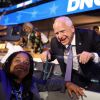 Minnesota governor and 2024 Democratic vice presidential nominee Tim Walz poses for pictures with an attendee on the first day of the Democratic National Convention at the United Center in Chicago on Monday. Walz is addressing the convention on Wednesday to accept the party's nomination.