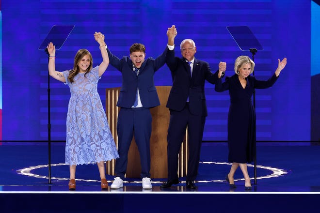 Minnesota Gov. Tim Walz celebrates with his daughter, Hope, his son, Gus, and his wife, Gwen, after accepting the Democratic vice presidential nomination during the third day of the Democratic National Convention at the United Center on Aug. 21, 2024, in Chicago.