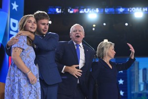 Minnesota Governor and 2024 Democratic vice presidential candidate Tim Walz with wife Gwen and children Gus and Hope on the third day of the Democratic National Convention in Chicago on Aug. 21, lilac, floral, lace, self-portrait dress