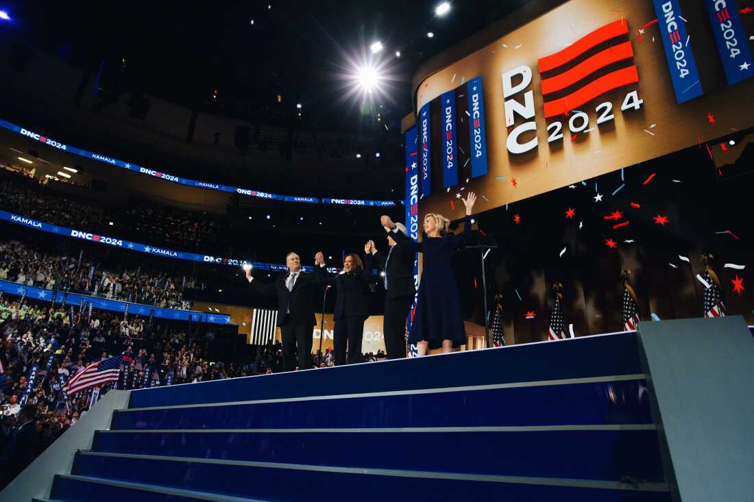 Doug Emhoff, Kamala Harris, Tim Walz and Gwen Walz on stage at the end of the Democratic National Convention.