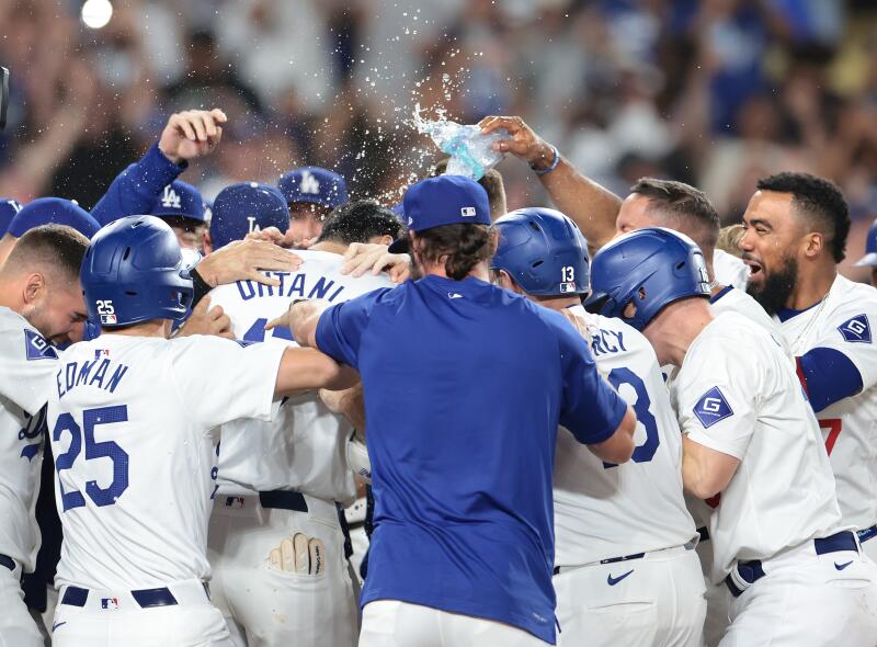 Shohei Ohtani celebrates with teammates after his walk-off grand slam.