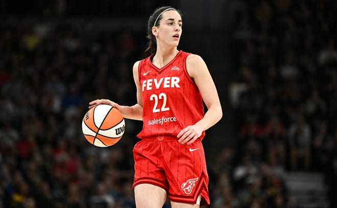 Caitlin Clark of the Indiana Fever dribbles the ball in the first quarter of the game against the Minnesota Lynx.