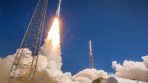 EPA A rocket lifts off, making plumes of smoke on the ground