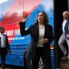 Democratic presidential candidate Vice President Kamala Harris and her running mate, Minnesota Gov. Tim Walz, disembark from their campaign bus in Savannah, Ga., on Wednesday, as they travel across Georgia on a 2-day campaign bus tour. 