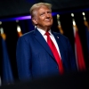 Republican presidential nominee and former President Donald Trump smiles at a crowd in Detroit on Monday.