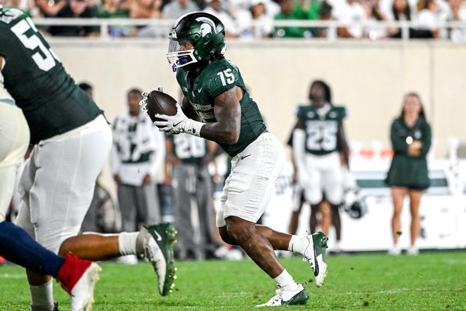 Michigan State's Kay'ron Lynch-Adams runs the ball against Florida Atlantic during the fourth quarter on Friday, Aug. 30, 2024, at Spartan Stadium in East Lansing.