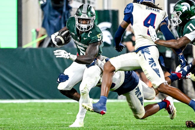 Michigan State's Nathan Carter runs the ball against Florida Atlantic during the fourth quarter on Friday, Aug. 30, 2024, at Spartan Stadium in East Lansing.