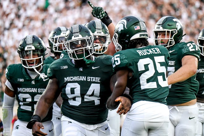 Michigan State's D'Quan Douse, left, celebrates his safety with teammates during the first quarter in the game against Florida Atlantic on Friday, Aug. 30, 2024, at Spartan Stadium in East Lansing.