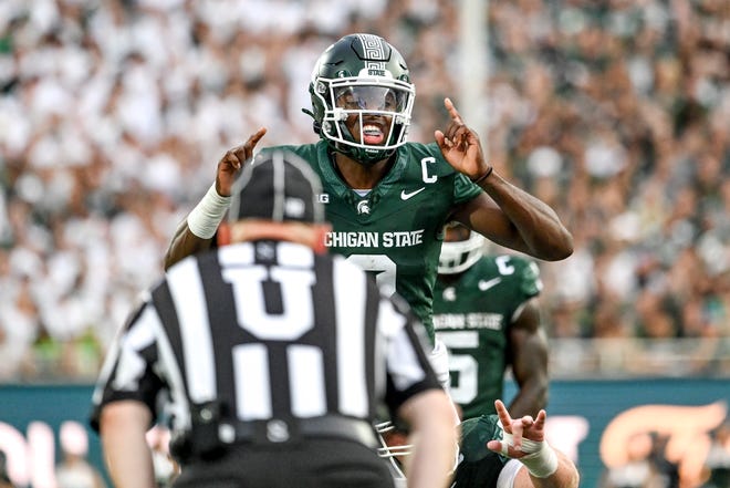 Michigan State's Aidan Chiles communicates with teammates against Florida Atlantic during the first quarter on Friday, Aug. 30, 2024, at Spartan Stadium in East Lansing.