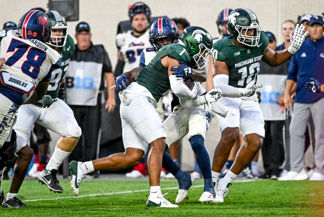 Michigan State's Nikai Martinez returns an interception against Florida Atlantic during the second quarter on Friday, Aug. 30, 2024, at Spartan Stadium in East Lansing.