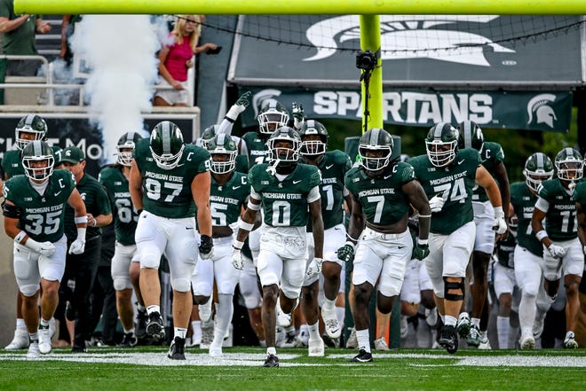 Michigan State takes the field before the game against Florida Atlantic during the first quarter on Friday, Aug. 30, 2024, at Spartan Stadium in East Lansing.