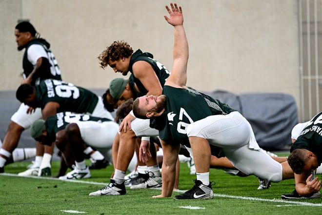 Michigan State's Maverick Hansen stretches before the game against Florida Atlantic on Friday, Aug. 30, 2024, at Spartan Stadium in East Lansing.