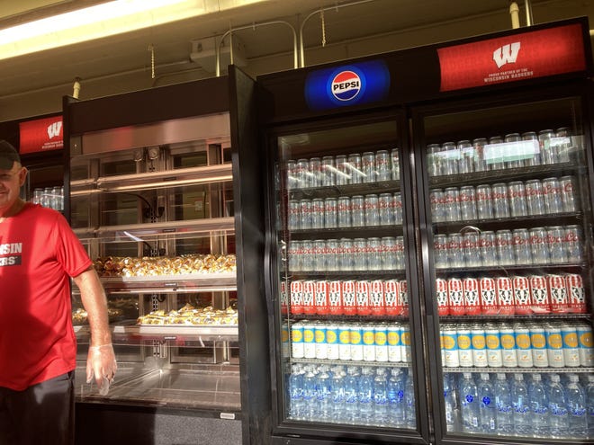 Beer lines the coolers at Camp Randall Stadium, where it's for sale in the general seating areas for the first time on Aug. 30, 2024.