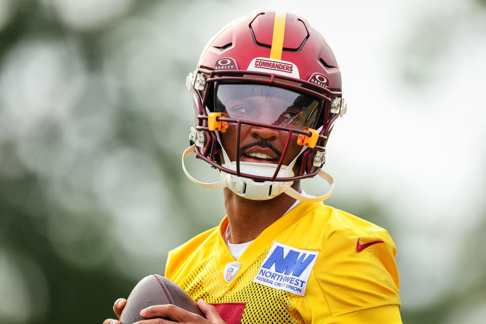 ASHBURN, VA - JULY 25: Jayden Daniels #5 of the Washington Commanders attempts a pass during training camp at OrthoVirginia Training Center at Commanders Park on July 25, 2024 in Ashburn, Virginia. (Photo by Scott Taetsch/Getty Images)