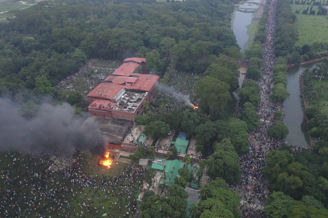 Fires burn outside the Prime Minister's House after Sheikh Hasina resigned and fled the country, on August 5, 2024 in Dhaka, Bangladesh.