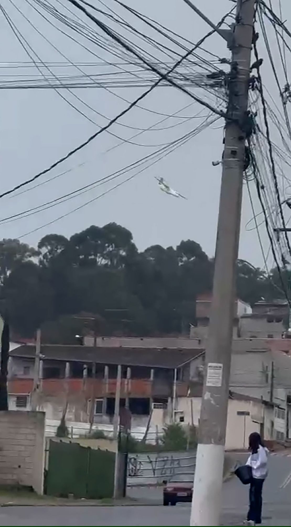 A plane is seen falling out of the sky into the city of Vinhedo, Brazil, on August 9, 2024.