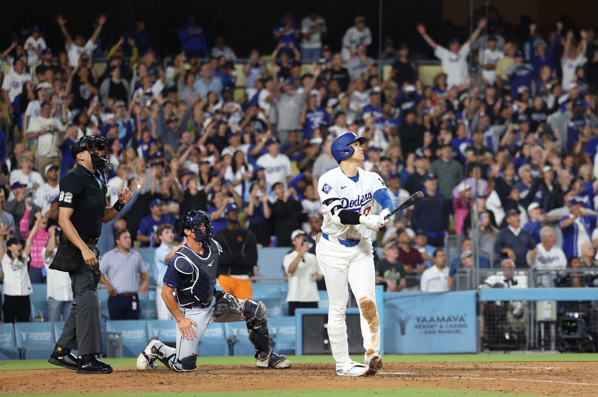 Shohei Ohtani hits a grand slam in the ninth inning to send the Dodgers to a 7-3 win over the Rays on Friday night.