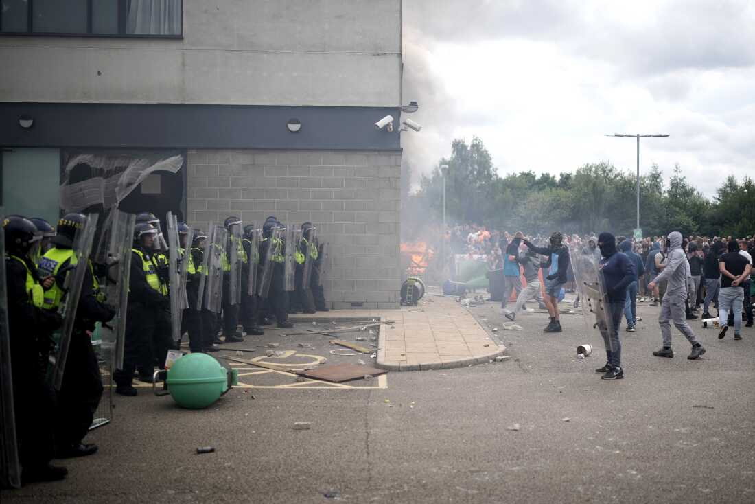 Riot police clashed with anti-immigration protesters outside of a Holiday Inn Express, which is used to house asylum seekers, in Rotherham, United Kingdom, on Sunday.