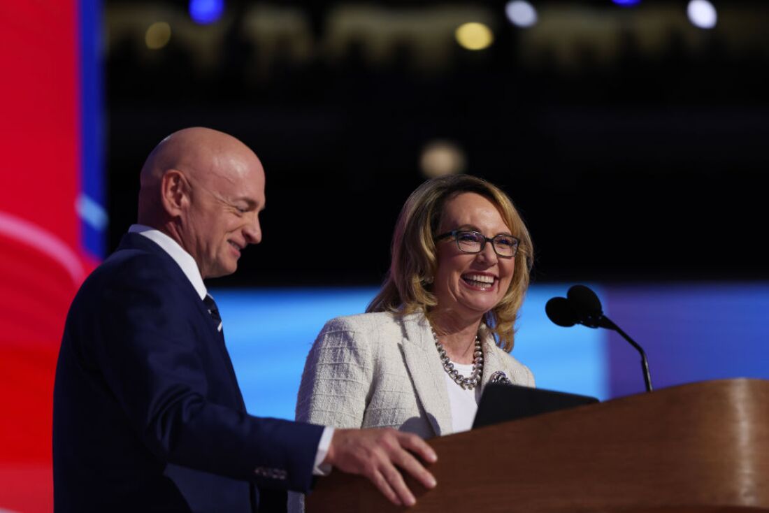 Gun control advocate and former U.S. Rep. Gabby Giffords, D-Arizona, speaks on stage with her husband, U.S. Sen. Mark Kelly, D-Arizona, during the final day of the DNC.