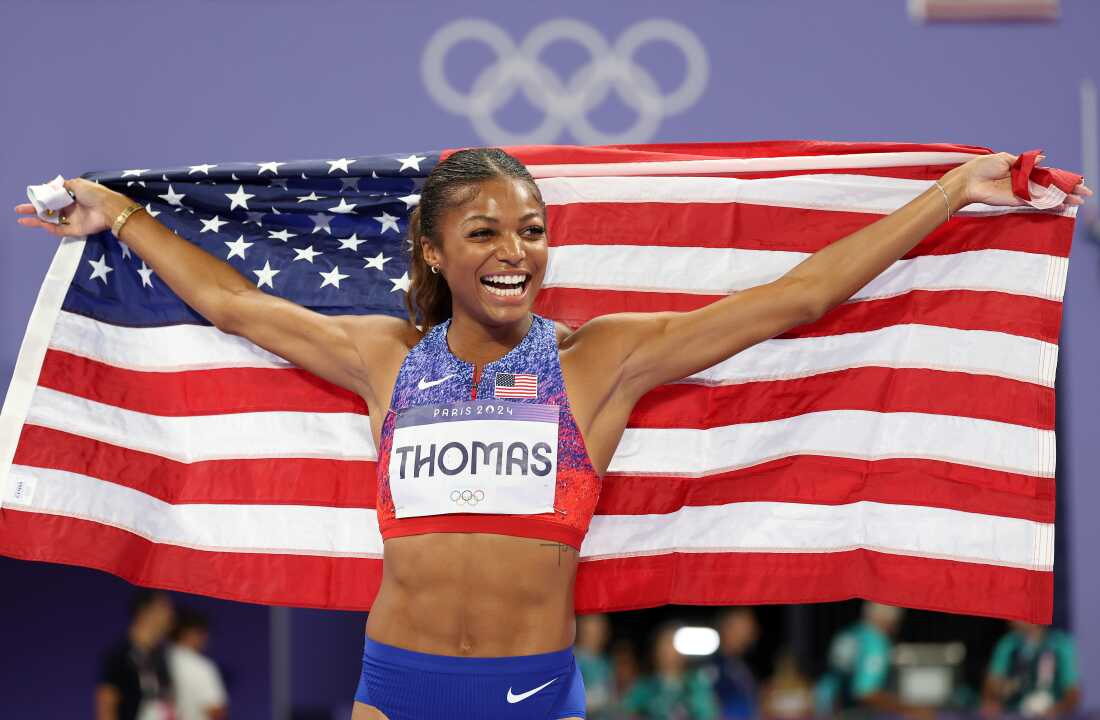 Sprinter Gabby Thomas of the U.S. celebrates winning the gold medal after competing in the women's 200m final on Tuesday at the Paris Olympic Games at Stade de France.