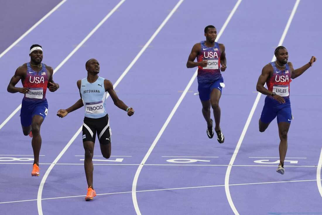 Letsile Tebogo, of Botswana (second left) won the men's 200-meters final ahead of Americans Noah Lyles (far left) and Kenneth Bednarek (left) at the Paris Olympics in Saint-Denis, France, on Thursday