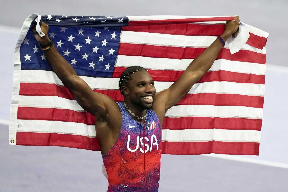 American sprinter Noah Lyles celebrates after winning the gold medal in in the men's 100-meters final at the Paris Olympics on Sunday in Saint-Denis.