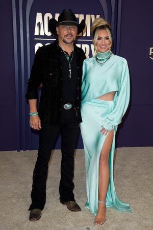 Jason Aldean and Brittany Aldean walk the carpet at the 59th ACM Awards at the Ford Center at the Star in Frisco, Texas, Thursday, May 16, 2024.