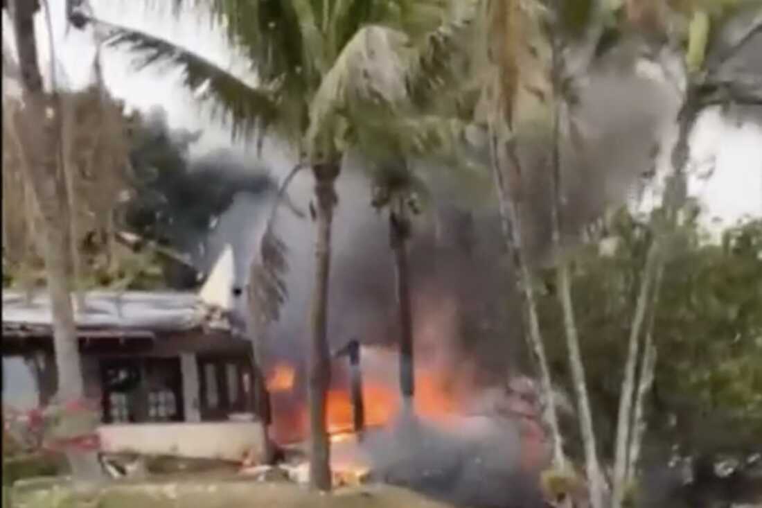 This frame grab from a video shows fire coming from a plane that crashed by a home in Vinhedo, Sao Paulo state, Brazil, Friday.