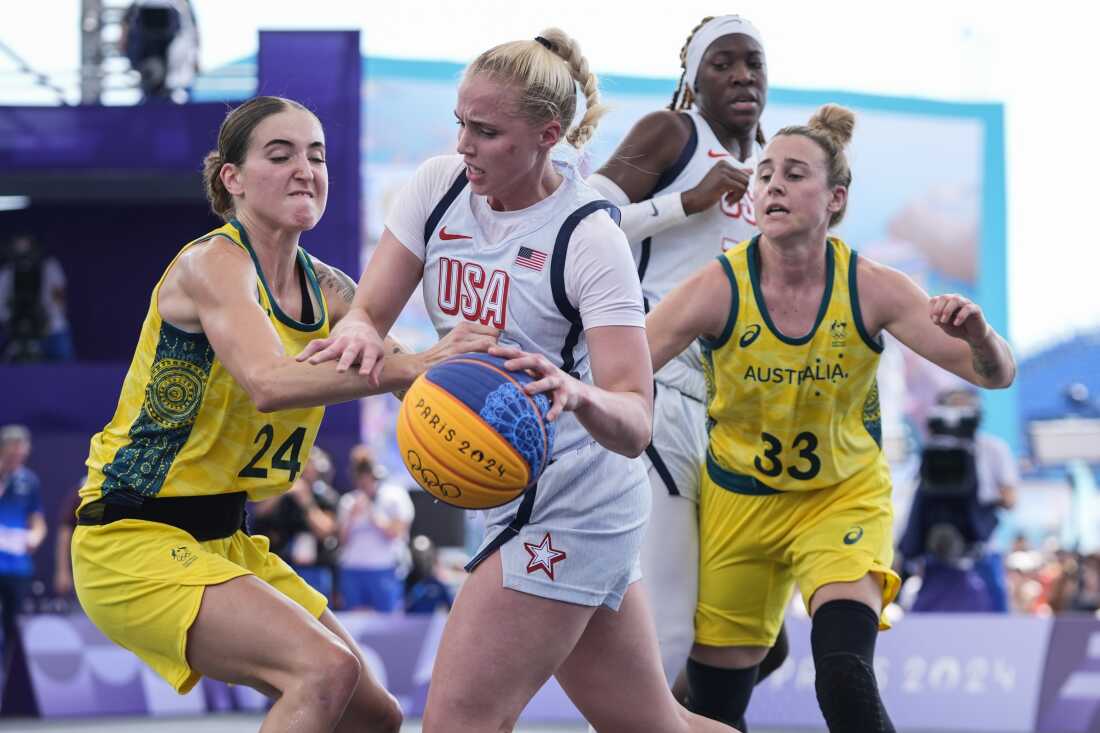 Australia's Anneli Maley (24) and Lauren Mansfield (33) defend Hailey van Lith, of the United States, in the women's 3x3 basketball pool round match during the 2024 Summer Olympics, on Thursday in Paris. Australia won 17-15.