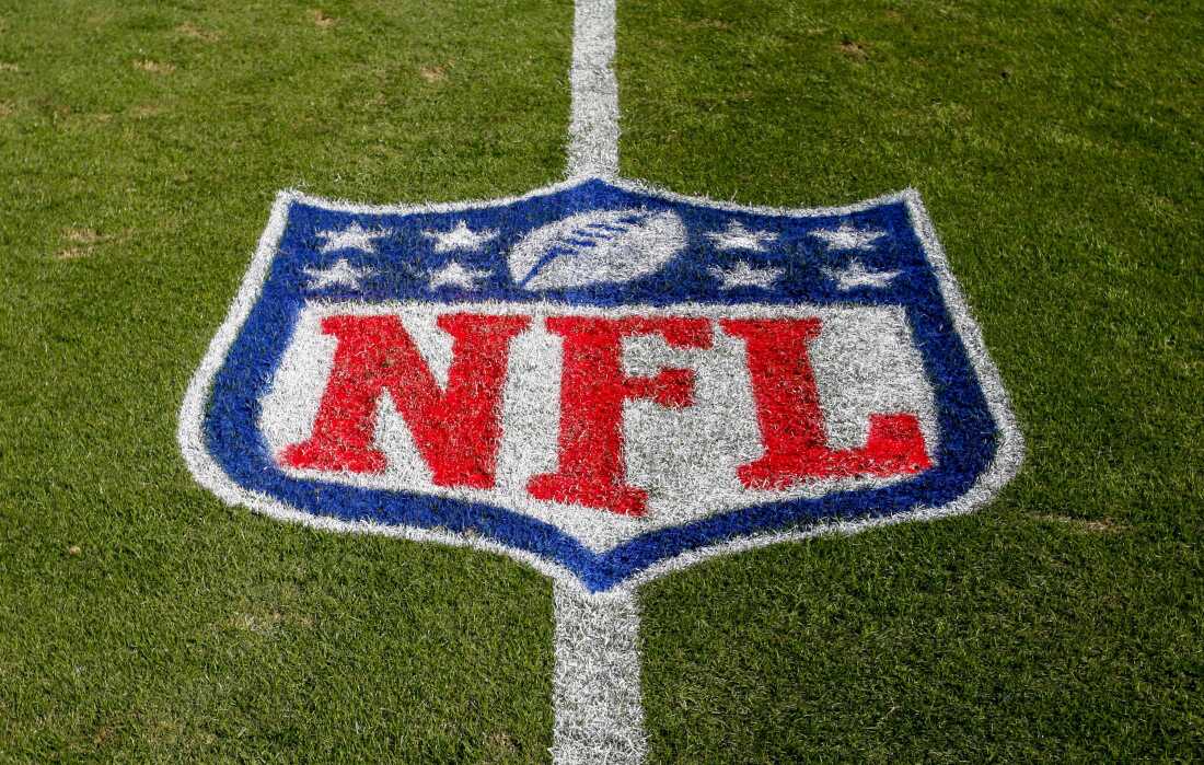 The NFL logo is displayed on the field in Charlotte, N.C., on Nov. 4, 2018. The judge who presided in a class-action lawsuit filed by “Sunday Ticket” subscribers against the NFL said Thursday that the jury did not follow his instructions in determining damages.