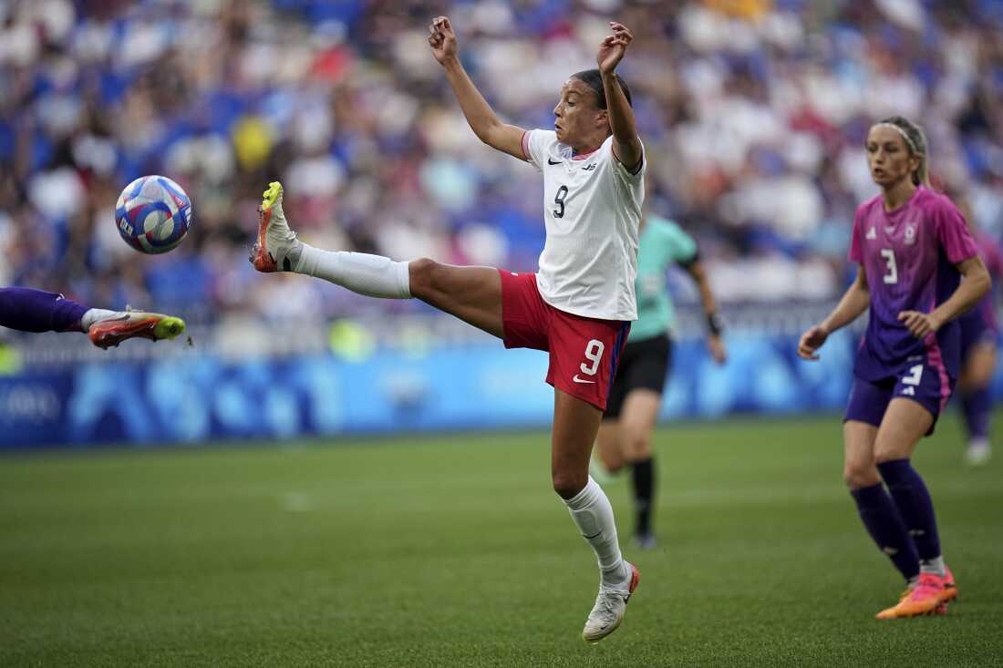 The U.S.'s Mallory Swanson fights for the ball during the women's semifinal soccer match between the United States and Germany at the 2024 Summer Olympics on Tuesday at Lyon Stadium in Decines, France.