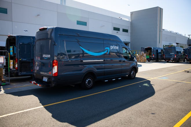 An Amazon van parked in a loading dock.