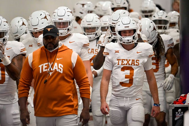 Nov 11, 2023; Fort Worth, Texas, USA; Texas Longhorns quarterback Quinn Ewers (3) walks with his teammates on to the field before the game between the TCU Horned Frogs and the Texas Longhorns at Amon G. Carter Stadium. Mandatory Credit: Jerome Miron-USA TODAY Sports